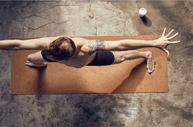 Non-slip cork yoga mat for men and women, sustainable and durable exercise mat providing strong grip and comfort for yoga, pilates, and home workouts.